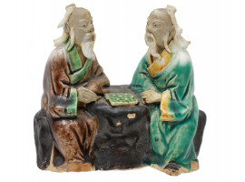 A CHINESE PORCELAIN FIGURINE OF TWO PLAYING SAGES