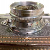 A VINTAGE LEICA M3 CAMERA WITH A CASE PIC-4