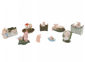 A LOT NINE GERMAN FAIRING PORCELAIN PIG FIGURINES