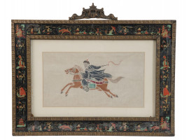 CHINESE WOODBLOCK OF A RIDER IN LACQUER FRAME