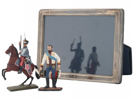 PAIR OF RUSSIAN TIN TOY FIGURES AND SILVER FRAME