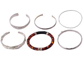 SIX VINTAGE STERLING SILVER AND AMBER BRACELETS