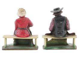 ANTIQUE CAST IRON AMISH COUPLE DOOR STOPPERS