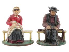 ANTIQUE CAST IRON AMISH COUPLE DOOR STOPPERS