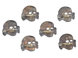 GROUP OF SIX GERMAN WWII TOTENKOPF INSIGNIAS