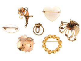 COLLECTION OF SEVEN VINTAGE 12K GOLD BROOCHES
