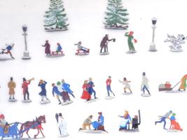 ANTIQUE TOY FIGURINES CHRISTMAS SLEIGH RIDERS SKATERS