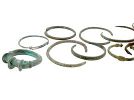 COLLECTION OF ANCIENT BRONZE BRACELETS, FLASK AND TRAY