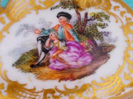 ANTIQUE GERMAN PORCELAIN LIDDED CUP AND SAUCER