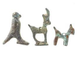 THREE SMALL ANCIENT ROMAN BRONZE AMULETS PIERCED