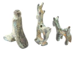 THREE SMALL ANCIENT ROMAN BRONZE AMULETS PIERCED