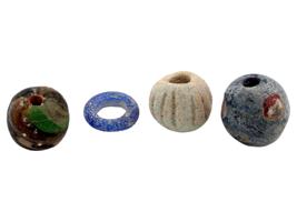 ANCIENT MULTICOLOR GLASS AND CARVED STONE BEADS