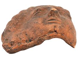 FRAGMENT OF AN ANCIENT ROMAN TERRACOTTA MASK