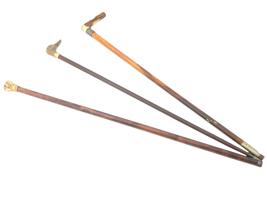 THREE WOODEN WALKING CANES WITH SILVER KNOBS