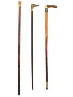 THREE WOODEN WALKING CANES WITH SILVER KNOBS