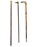 THREE WOODEN WALKING CANES WITH SILVER KNOBS