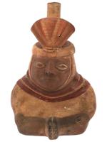 PRE COLUMBIAN STIRRUP BOTTLE WITH A SEATED FIGURE