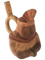 PRE COLUMBIAN STIRRUP BOTTLE WITH A SEATED FIGURE