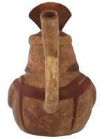 PRE COLUMBIAN STIRRUP BOTTLE WITH A SEATED FIGURE