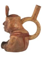 PRE COLUMBIAN STIRRUP BOTTLE WITH A SEATED FIGURE