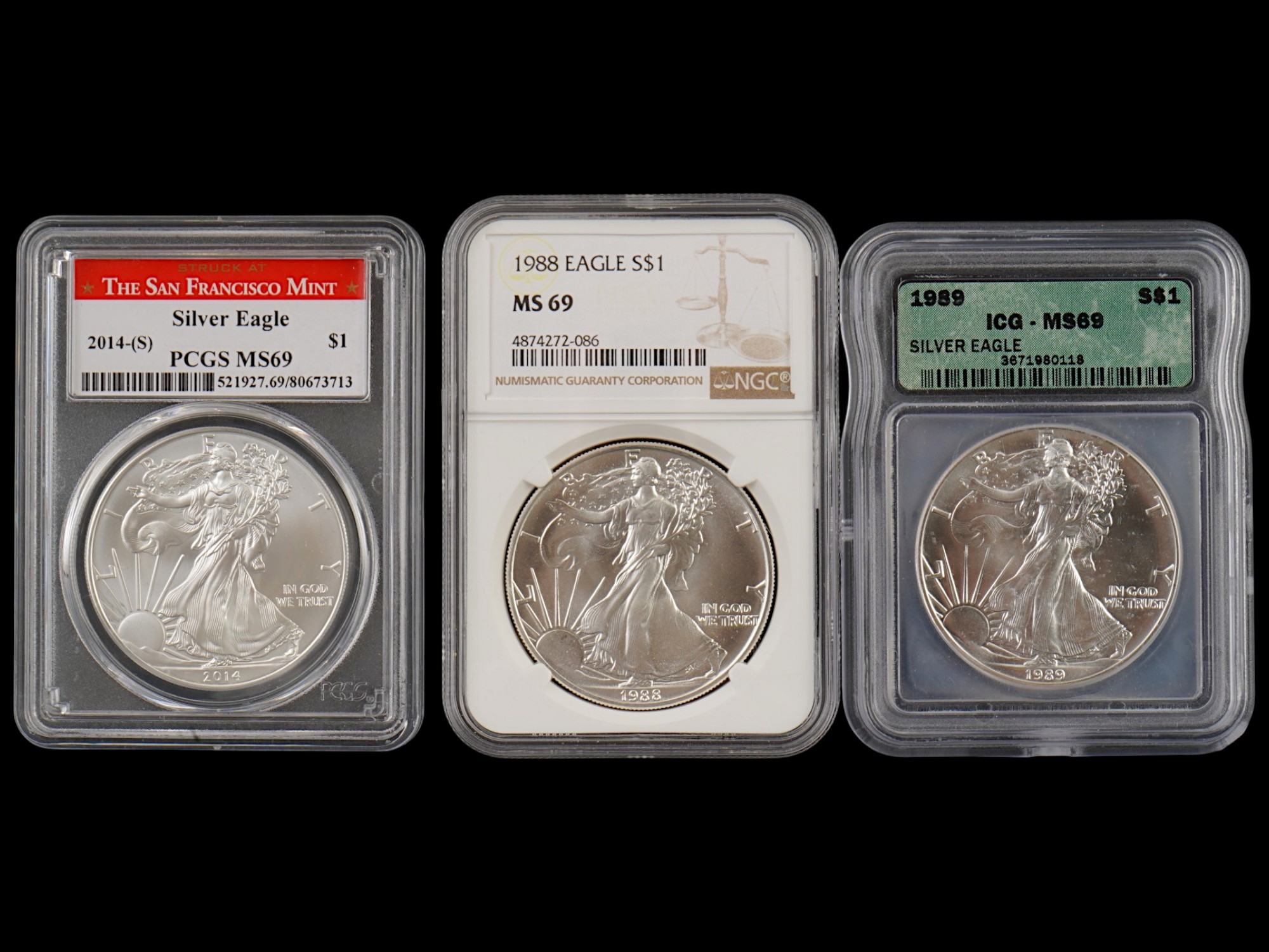 THREE VINTAGE AMERICAN SILVER EAGLE COINS GRADED PIC-