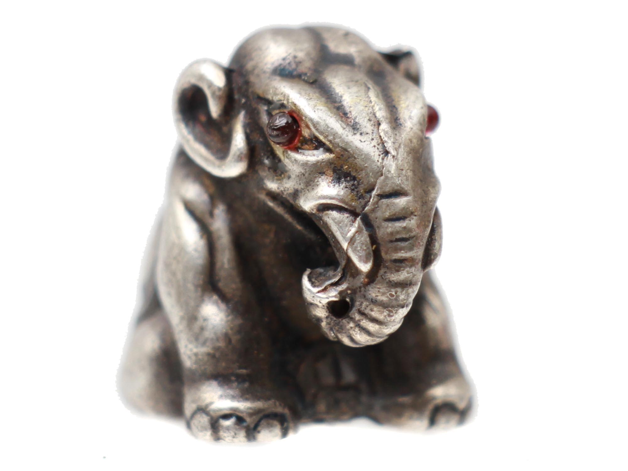 A RUSSIAN SILVER ELEPHANT FIGURINE WITH RUBY EYES PIC-0