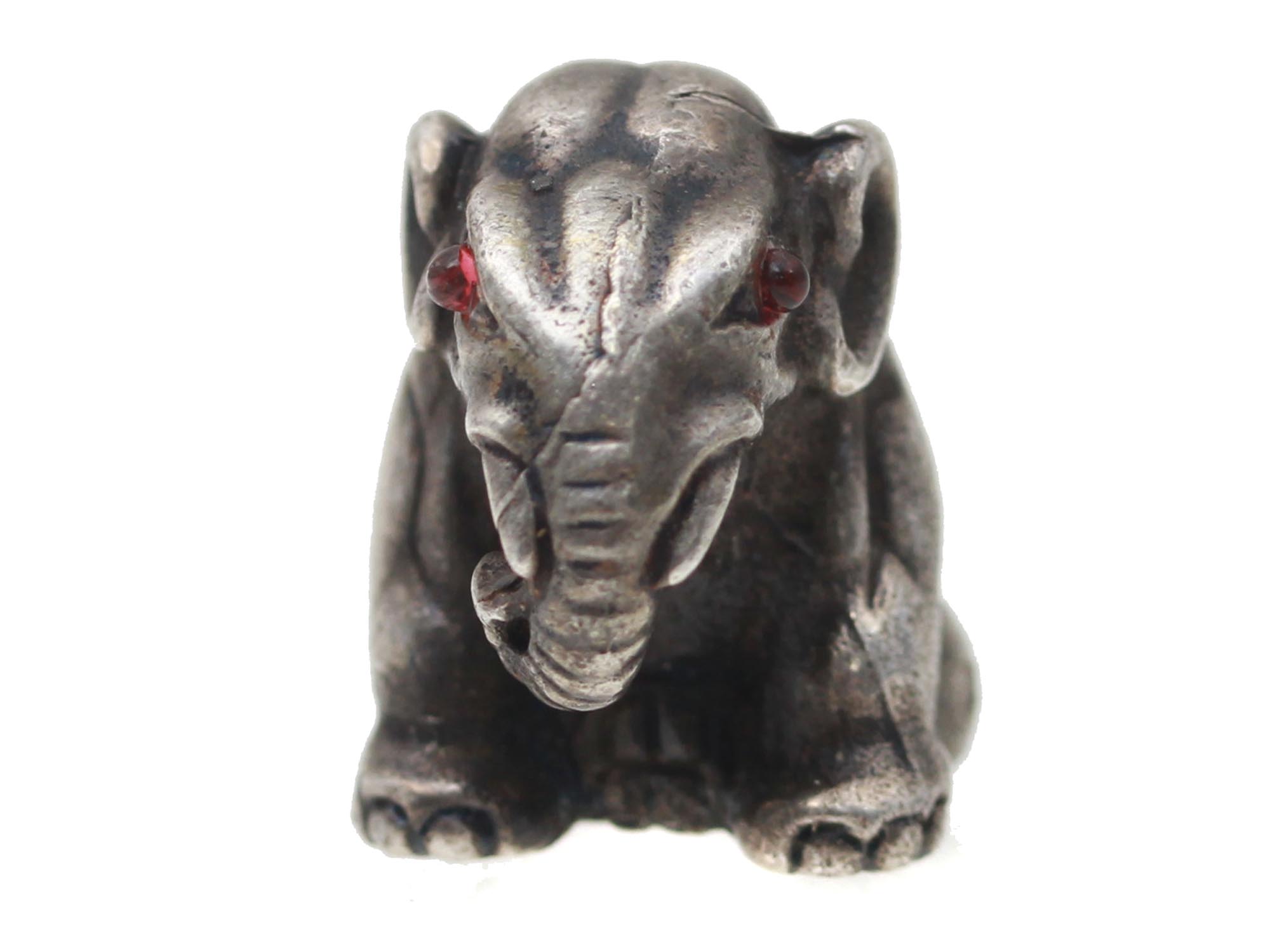 A RUSSIAN SILVER ELEPHANT FIGURINE WITH RUBY EYES PIC-2