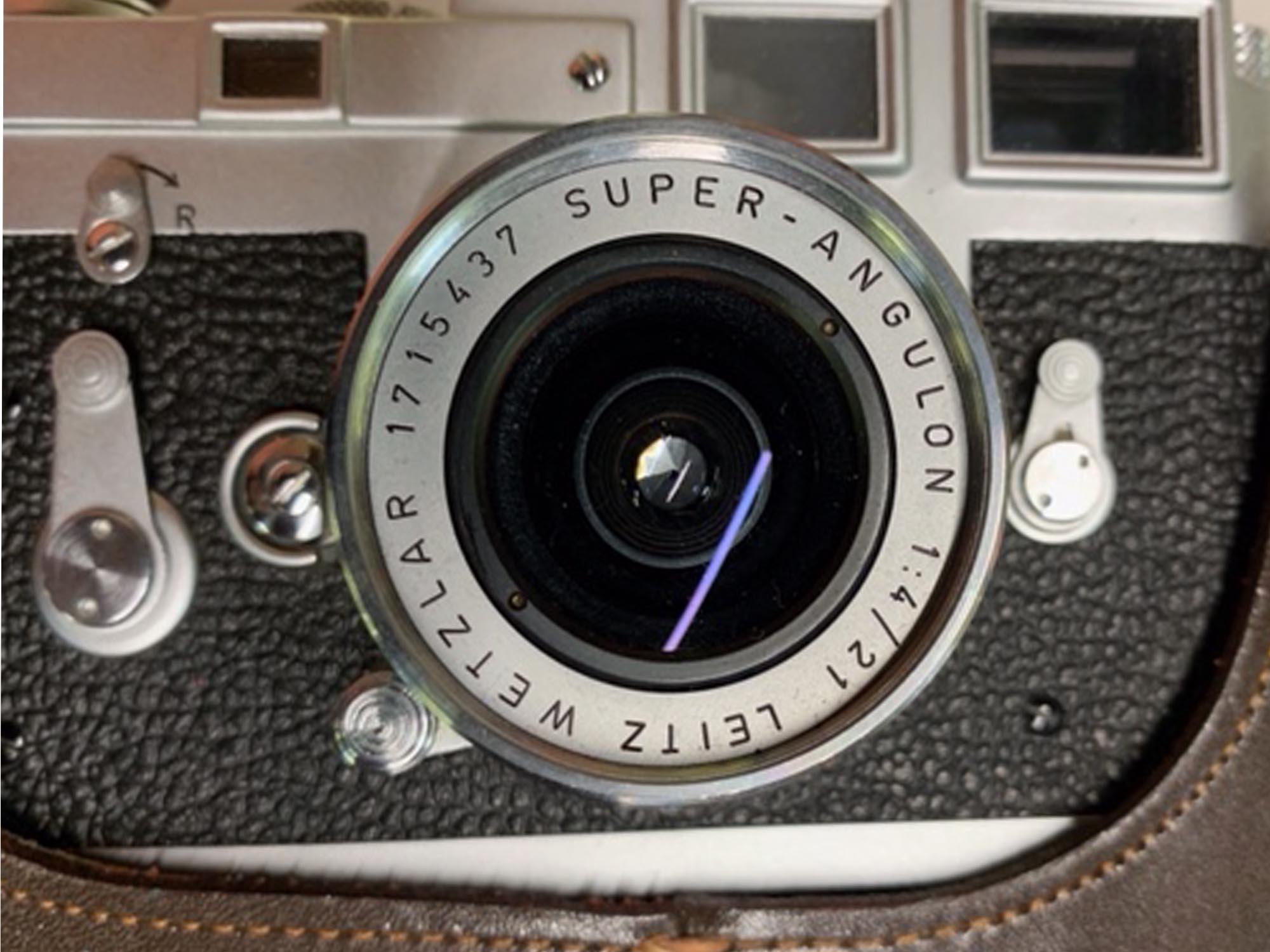 A VINTAGE LEICA M3 CAMERA WITH A CASE PIC-3