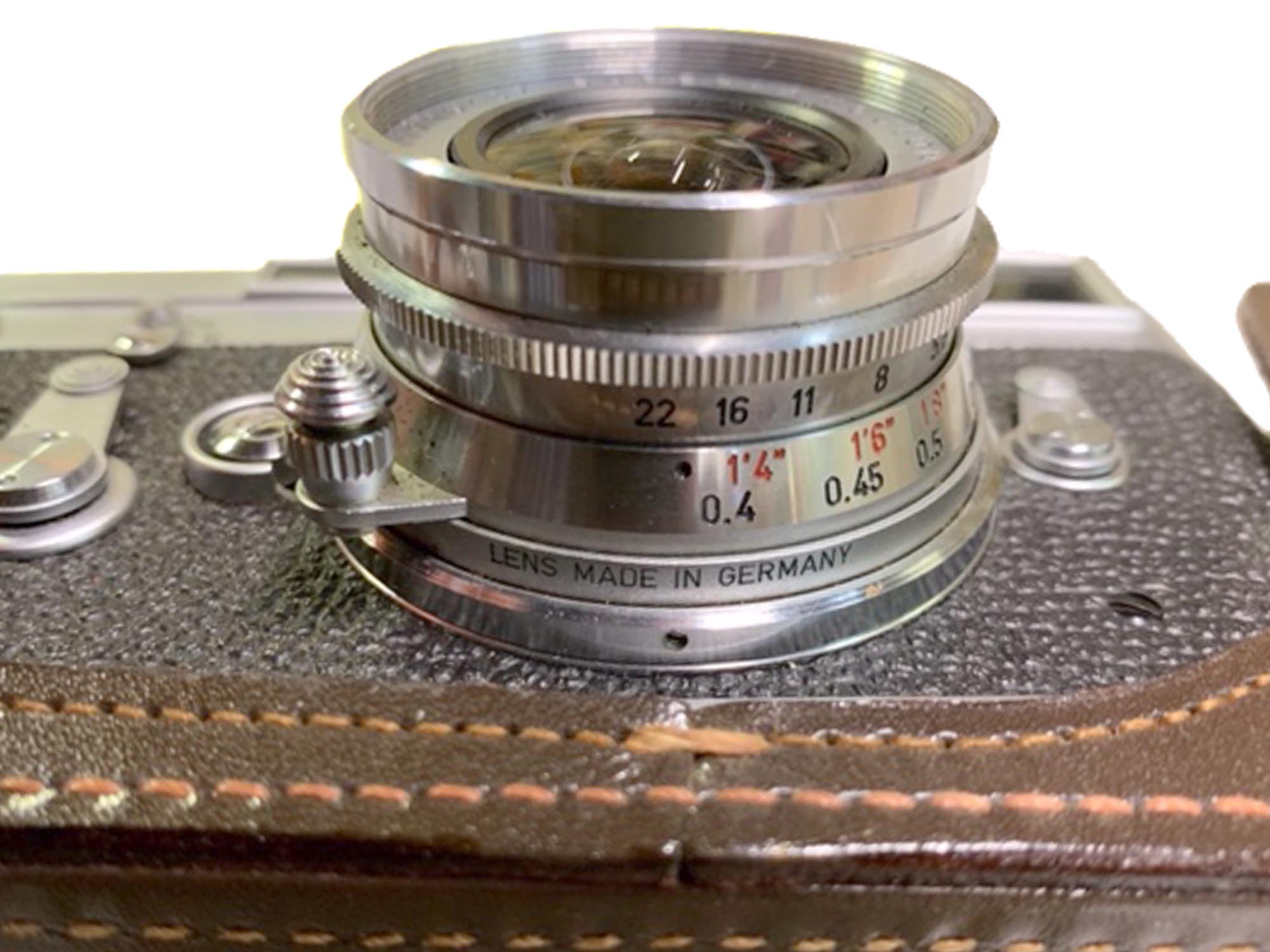 A VINTAGE LEICA M3 CAMERA WITH A CASE PIC-4