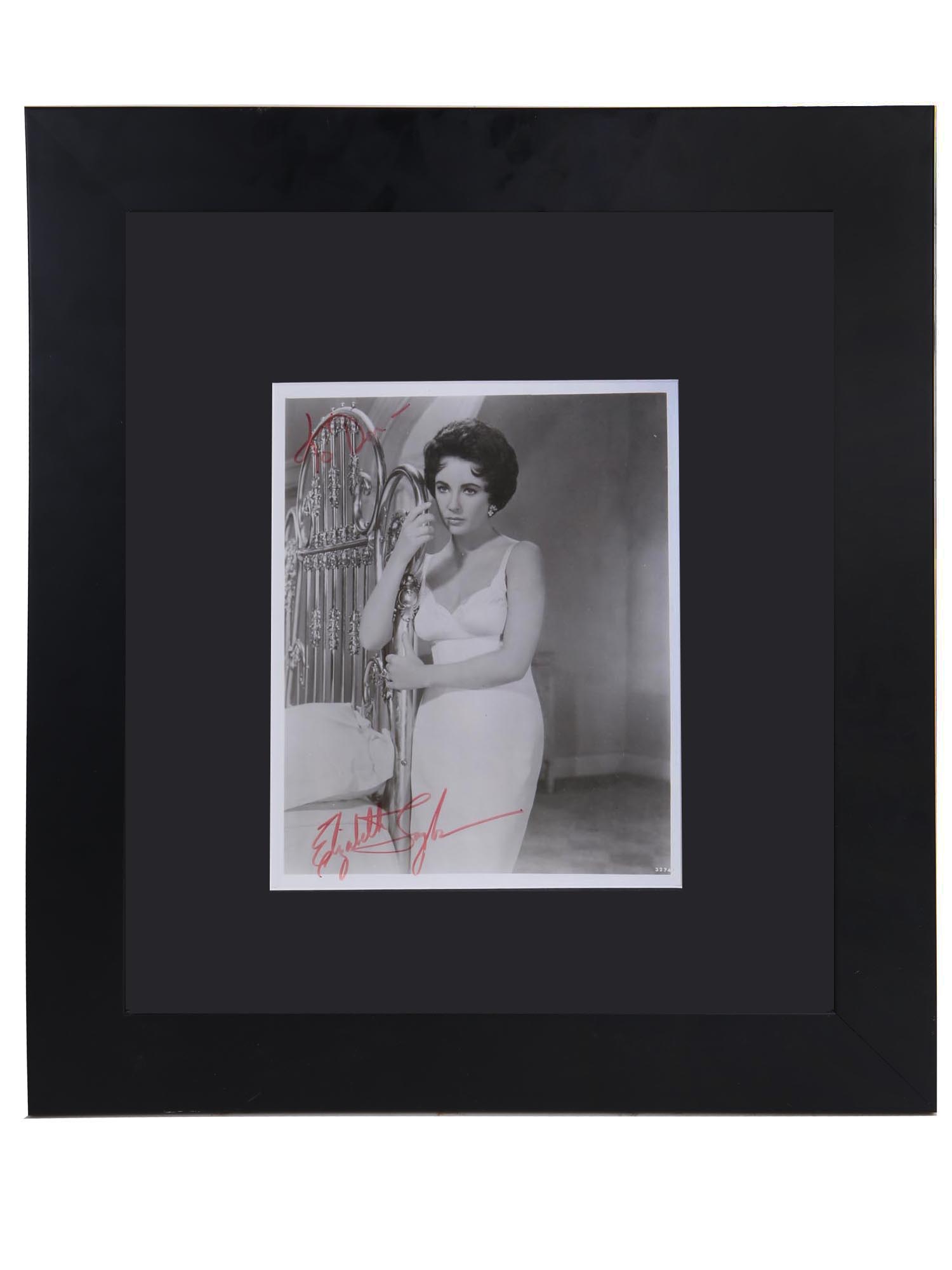 A BLACK & WHITE PHOTO OF ELIZABETH TAYLOR SIGNED PIC-0