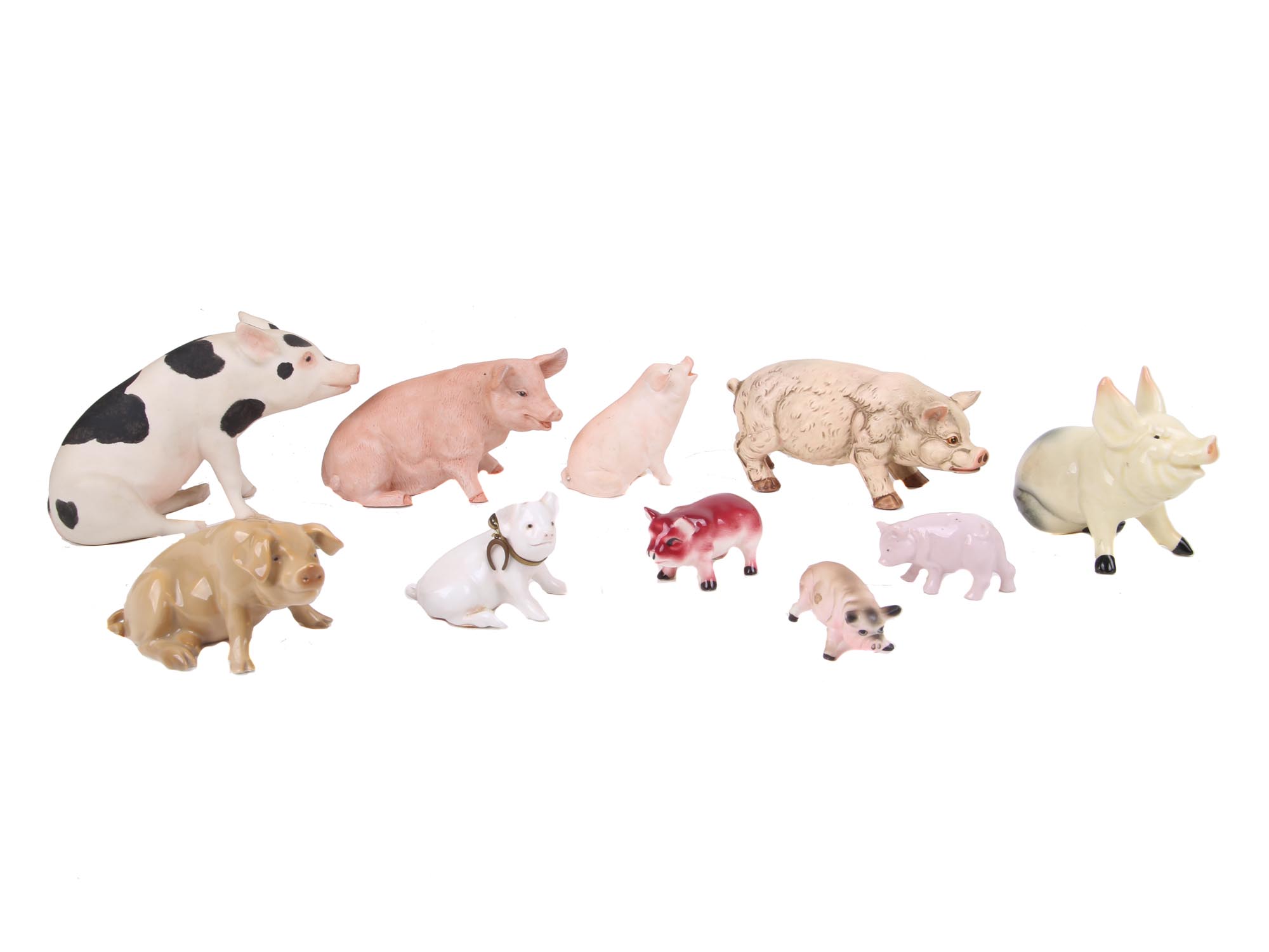 A COLLECTION OF VARIOUS PORCELAIN PIG FIGURINES PIC-0