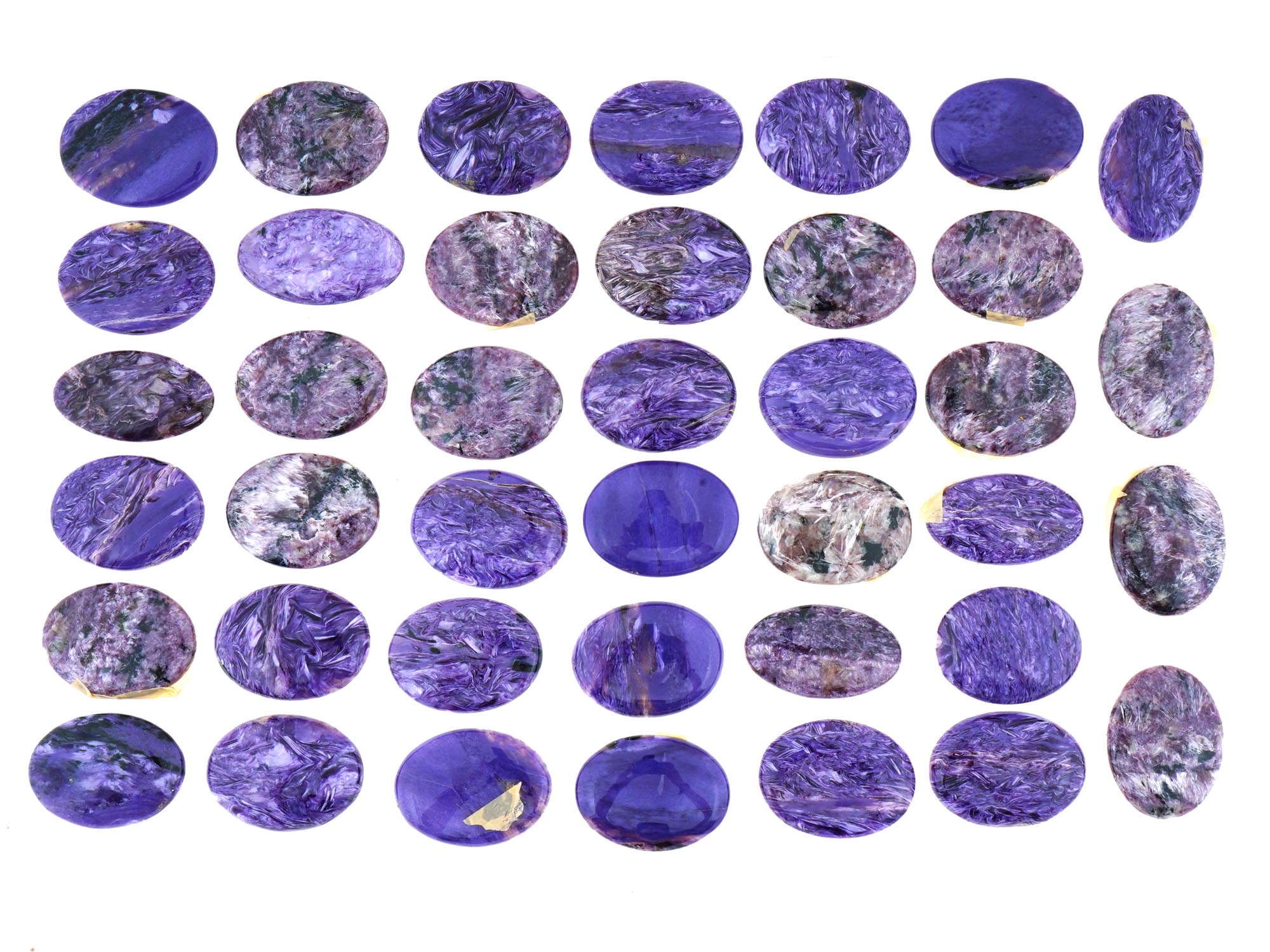 LARGE COLLECTION OF CARVED OVAL CHAROITE STONES PIC-0