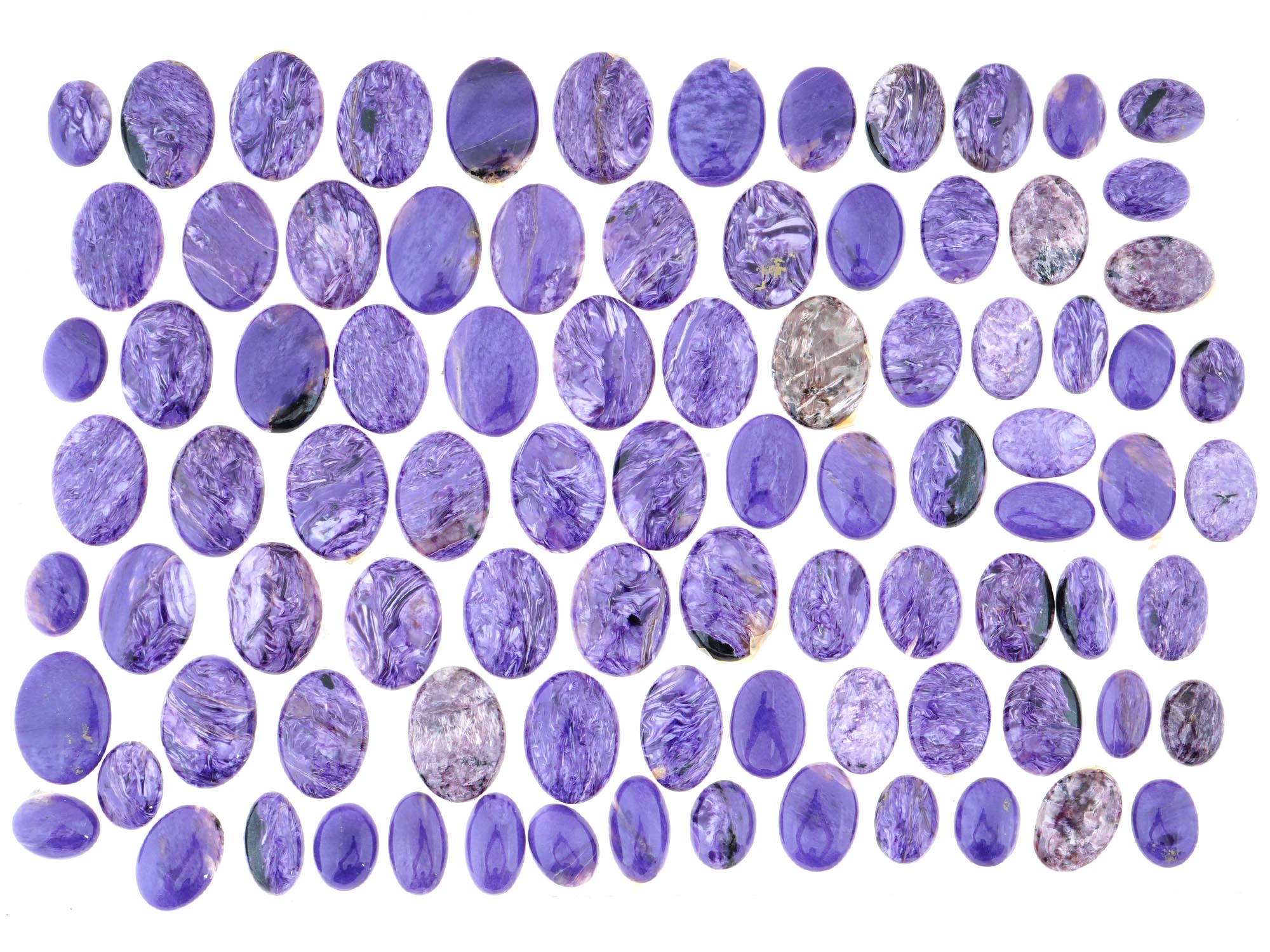 LARGE COLLECTION OF CARVED OVAL CHAROITE STONES PIC-0