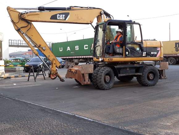 excavadora sobre ruedas caterpillar año 2014