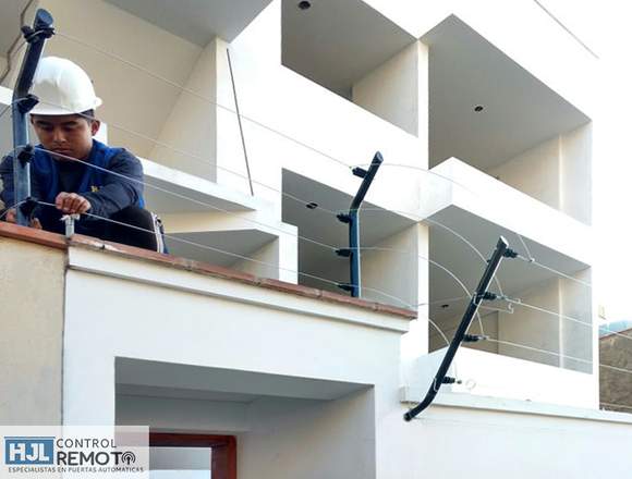 Instalación de puerta levadiza y cerco eléctrico