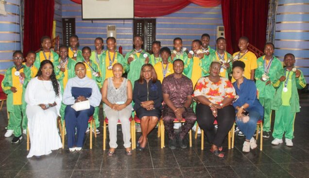 cdc the managing director chrisland schools limited mrs ibironke adeyemi front role centre takes a photgraph with parents and some of the athletes mt x