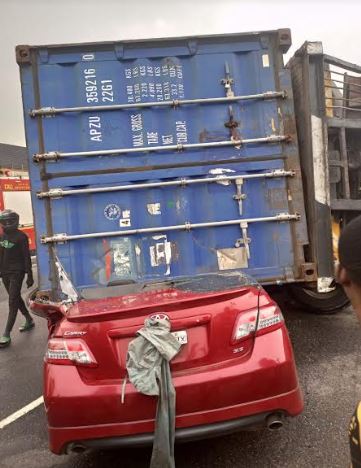 Driver escapes death as container crushes car in lagos - nigeria newspapers online