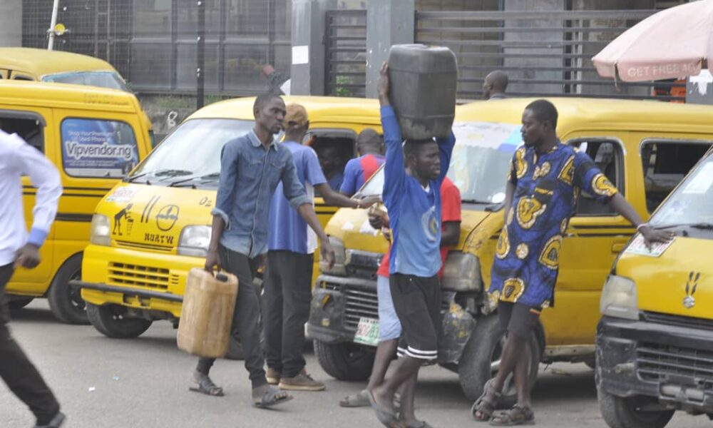 Photos lagos residents buy fuel in jerry cans as scarcity persists - nigeria newspapers online