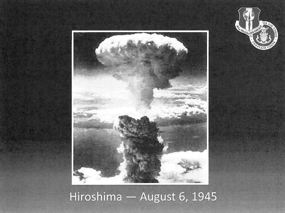 Slide with an image of the Hiroshima atomic bomb explosion and the text "Hiroshima — August 6, 1945".