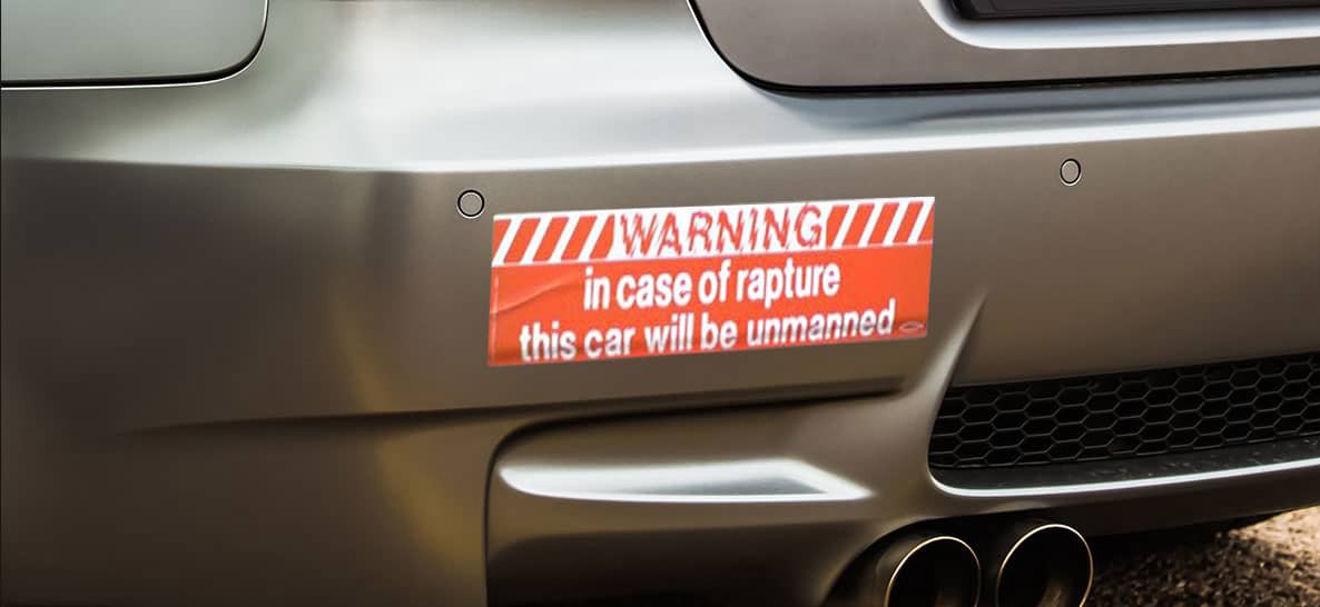 A bumper sticker reading "WARNING: in case of rapture this car will be unmanned."