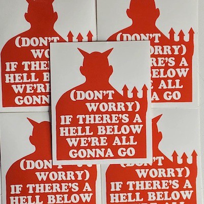 Rectangular white stickers with a devil's silhouette in red and the text "(DON'T WORRY) IF THERE'S A HELL BELOW WE'RE ALL GONNA GO."