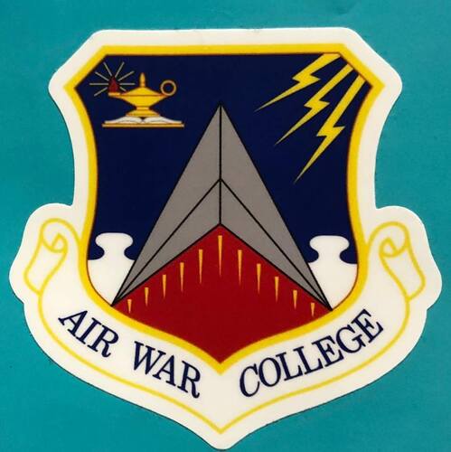Crest for Air War College, with an oil lamp on top of a book in the upper left, a Star Trek--esque "delta" in the middle and soome lightning bolts coming from the upper right, as well as some jigsaw pieces coming up from the bottom.