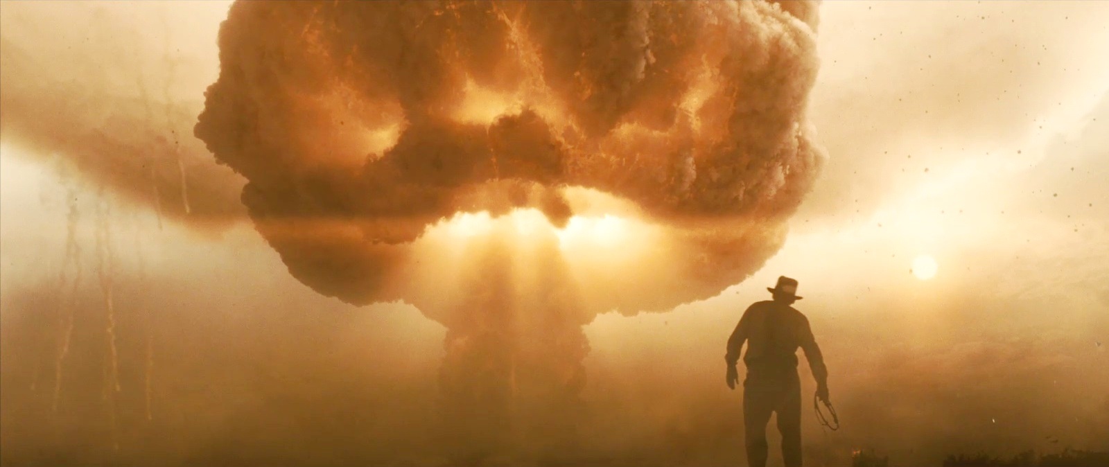 Indiana Jones in front of a mushroom cloud.