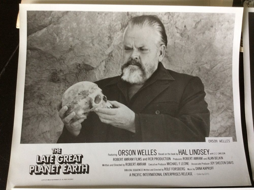 Orson Welles holding a skull in a poster for the 1977 film version of Late Great Planet Earth.