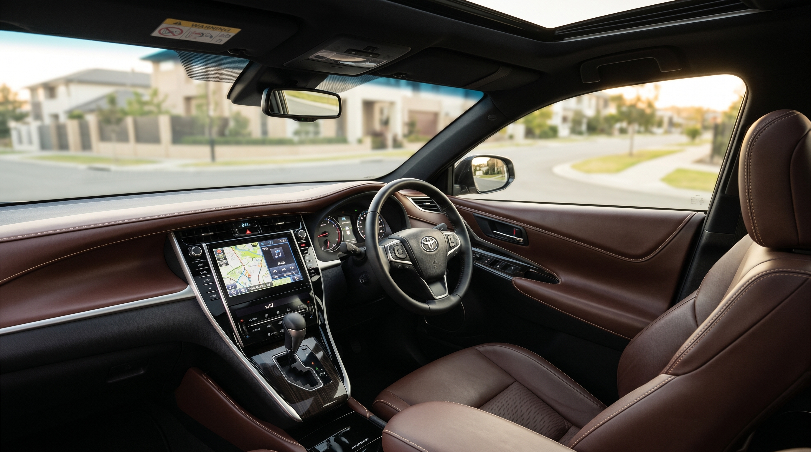 トヨタ・ハリアー60系後期の運転席から見た高級感あふれるインテリアの様子。上質なレザーシートやステッチが、大人の余裕とステータスを感じさせる車内空間です。
