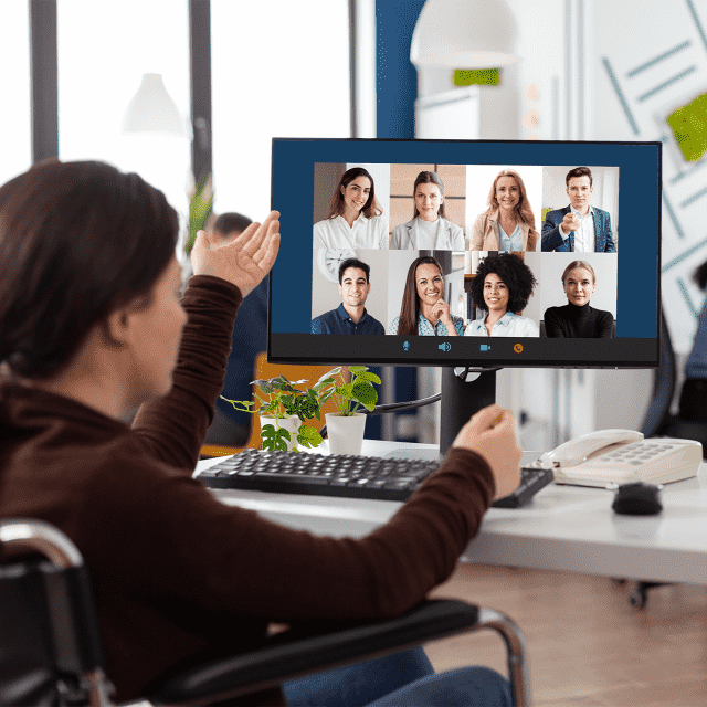 A person on a video call with eight people on a desktop screen, representing Appivo custom app development services training a client.