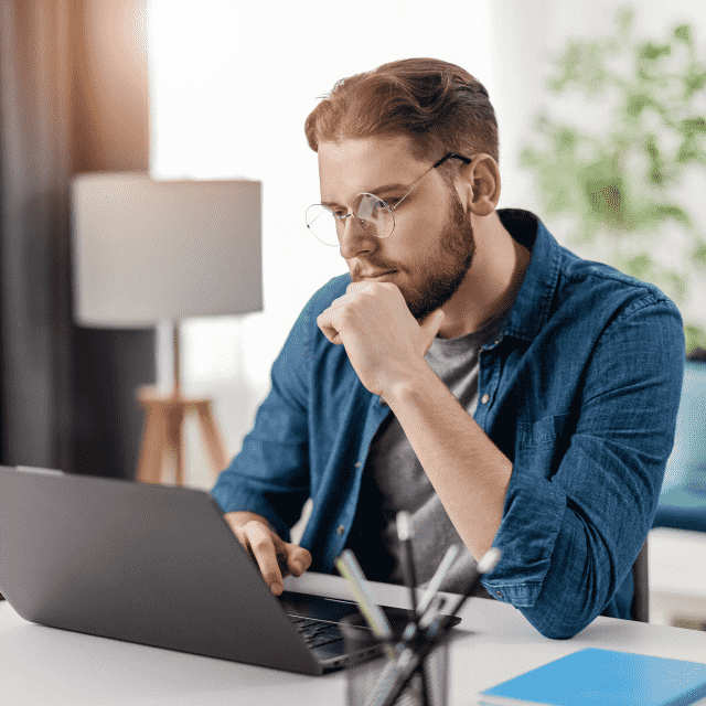 Man sitting in front of a laptop, representing a developer from Appivo custom app development services.