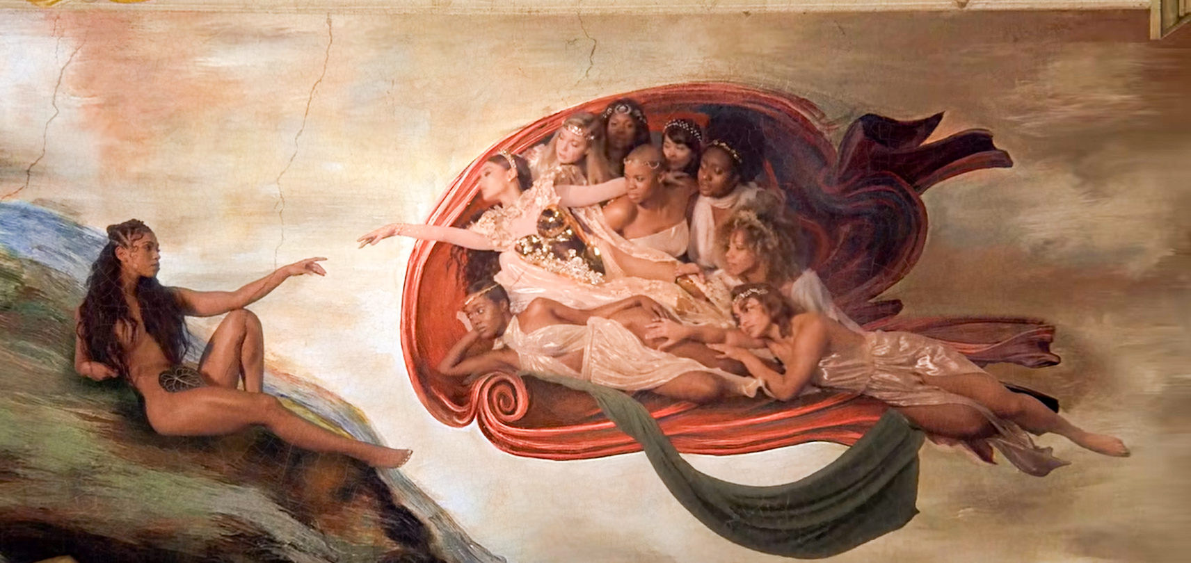 Still from Ariana Grande's 'God is a Woman' music video (2018), recreating Michelangelo's Creation of Adam with Grande as God and a Black woman as Adam.