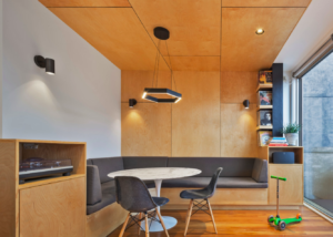 Grey banquet with round white table and wooden walls and ceiling