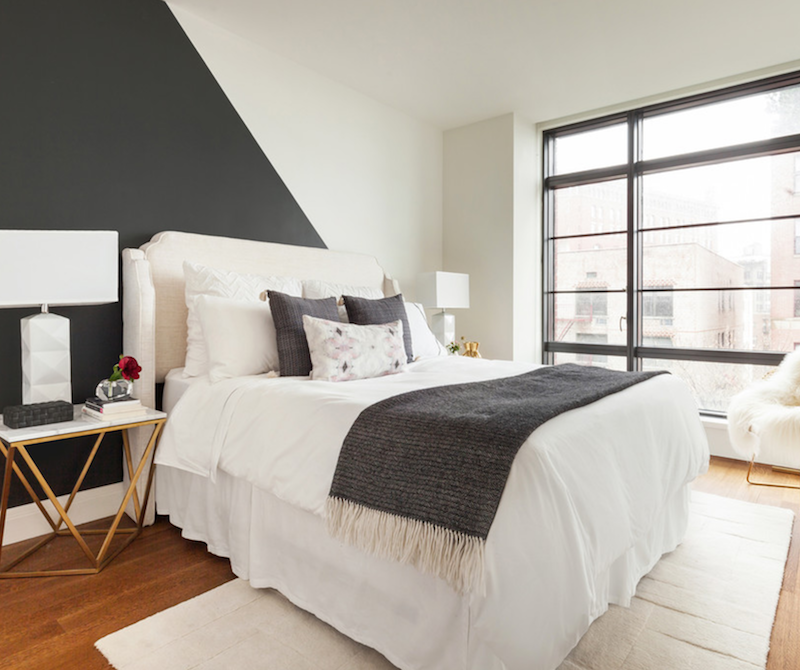 white bedding helps ground this geometric design